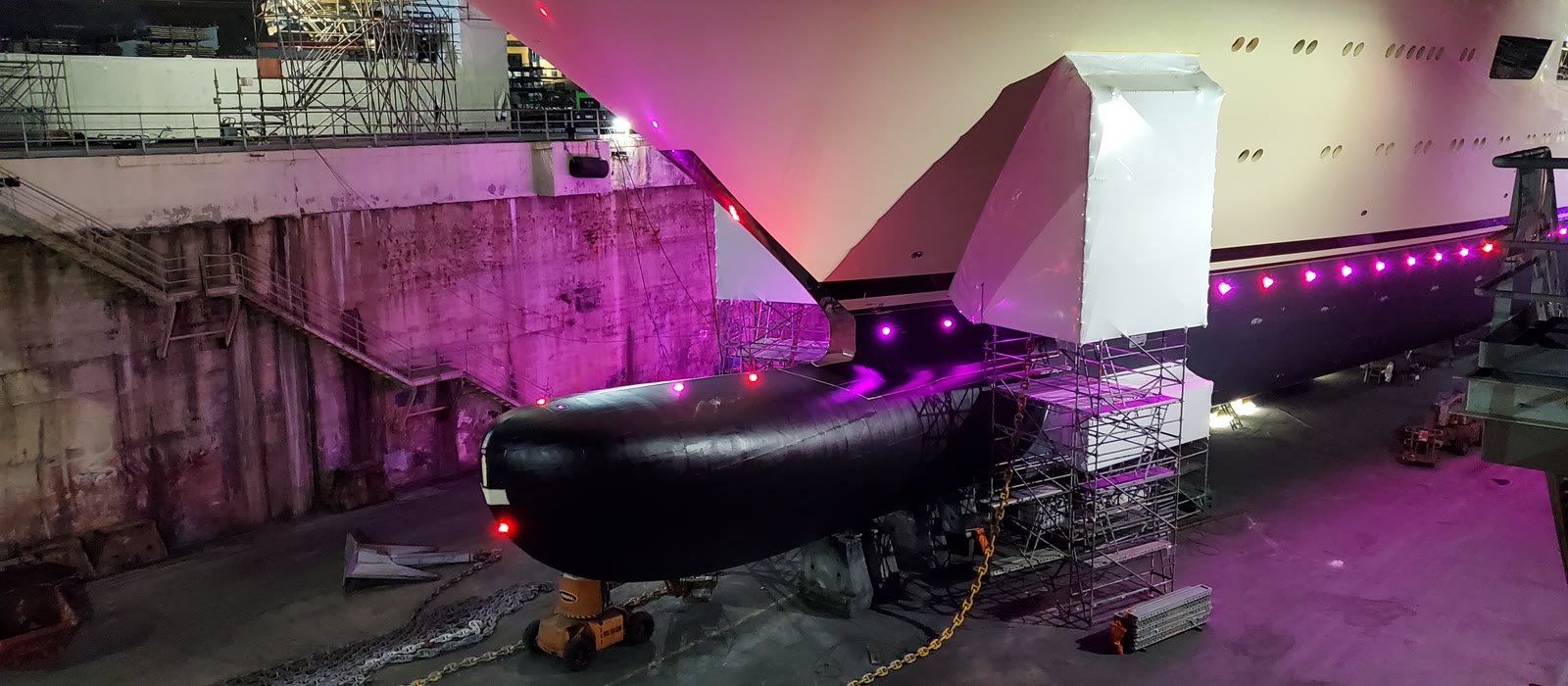 A yacht in dry dock at a refit yard